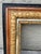 Beautiful ornate wood frame with a gilded inner molding, a carved wood mid-section and a black outer border. Vintage. Can...