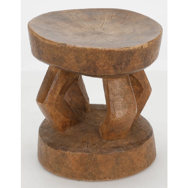 Handcrafted by the Dogon people of Mali, this sculptural stool embodies centuries of West African artisanal tradition....