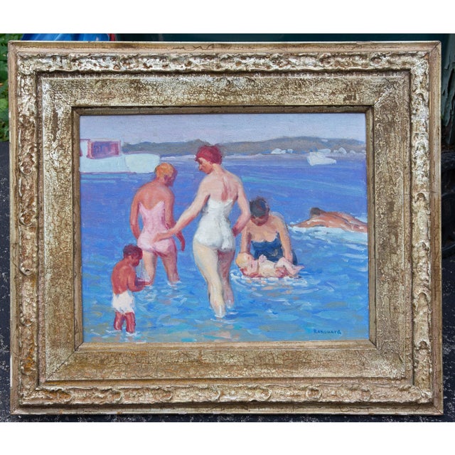 American Impressionist beach scene by George Renouard. Painting depicts a family of bathers at the shore. The figures are...