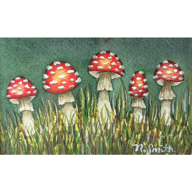 A lively cluster of red-and-white mushrooms stands tall among whispering grasses in this enchanting forest vignette. The...