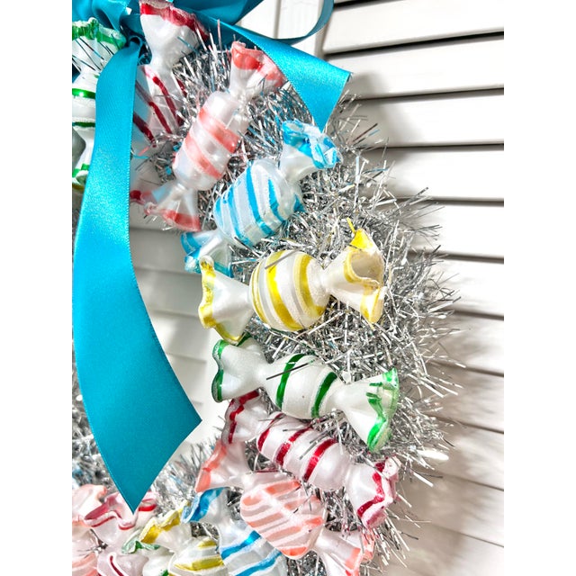 A one-of-a-kind handmade Christmas wreath constructed from vintage hand-blown glass candy ornaments and vintage tinsel....