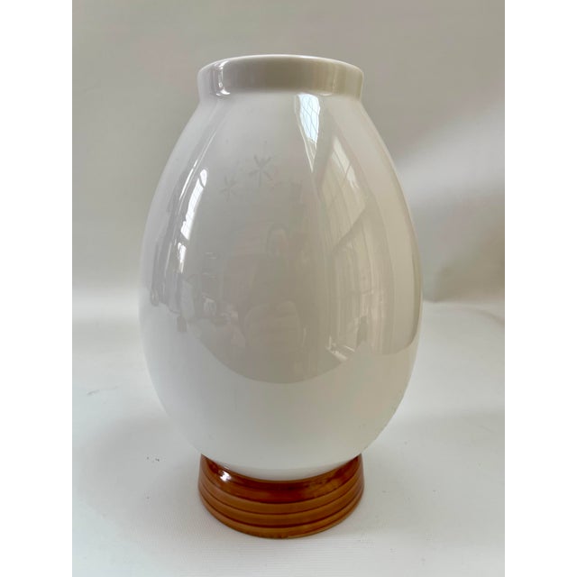 Striking hand-decorated vase with center exotic parrot surrounded by vibrant floral motif. Maker's mark on underside. In...