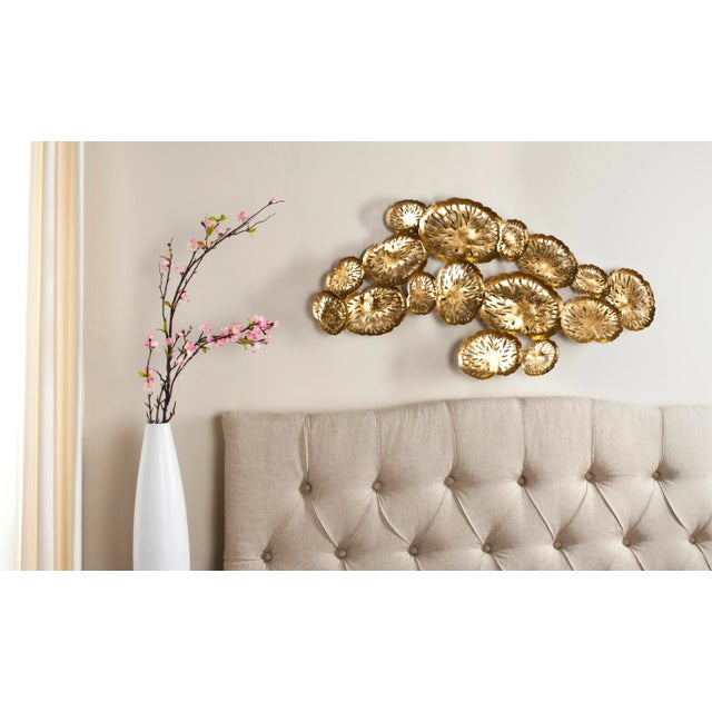 A shimmering coral reef, graphically displayed in etched gold plumes, becomes evocative wall décor in the Coral Plate from...