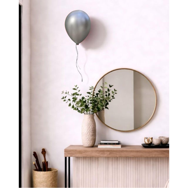 Ceramic Silver balloon wall sculpture designed as a jewel for your home. Handcrafted from clay, and coated with high...