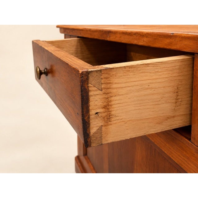 Pair of low corner cabinets with plinths in solid cherry wood, in the Louis-Philippe style. Pentagonal shape...