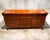 This particular sideboard, crafted from walnut, showcases the Neoclassical aesthetic with its clean lines, tapered legs,...