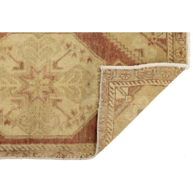 Elevate your interior with this exquisite Antique Turkish Oushak wool rug, beautifully sized as an accent mat. Hand-...