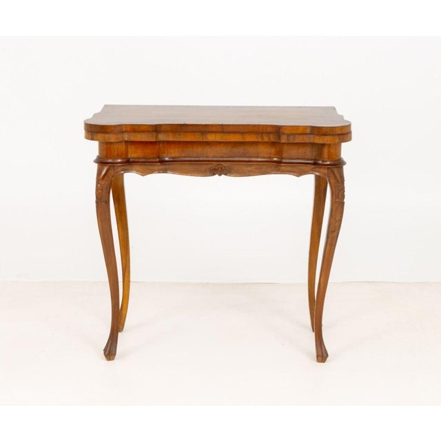 Louis XV Style Walnut Lift Top Game Table, the table top with fish pond depressions at each corner on carved cabriole...
