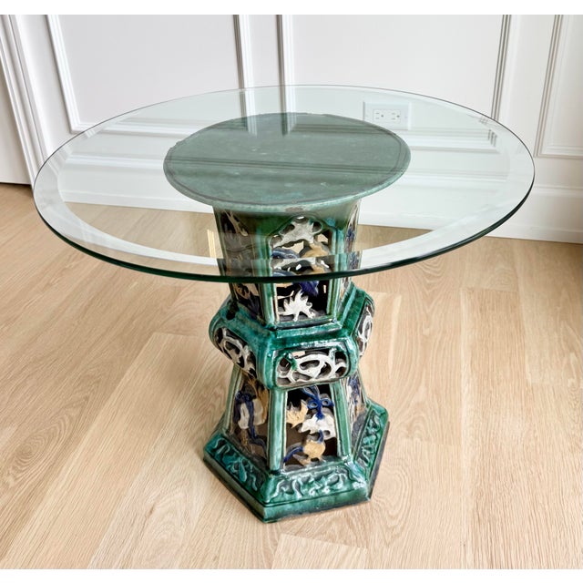 Exquisite 1950s Chinese export ceramic pedestal table featuring intricate openwork decoration and a richly glazed emerald...