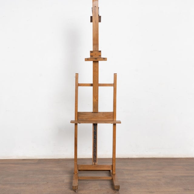 Late 19th Century Antique Wood Painter's Easel This vintage artist's easel rests on four casters. It reveals years of use...