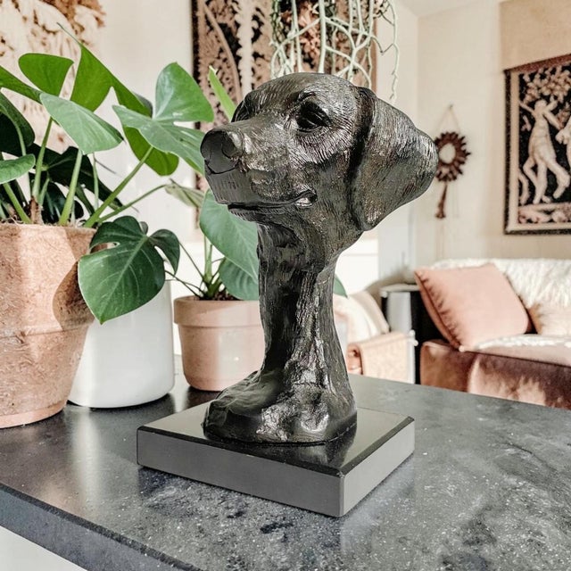 Elevate your home decor with this striking Black Metal Dog Bust, expertly crafted to showcase the majestic features of a...