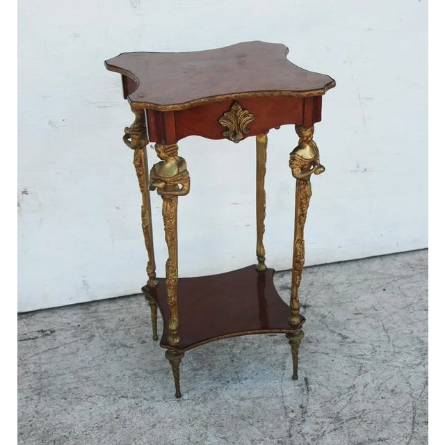 Empire Gilt Mounted Bronze Table In the manner of François Linke. Beautiful inlaid parquetry top with each leg adorned by...