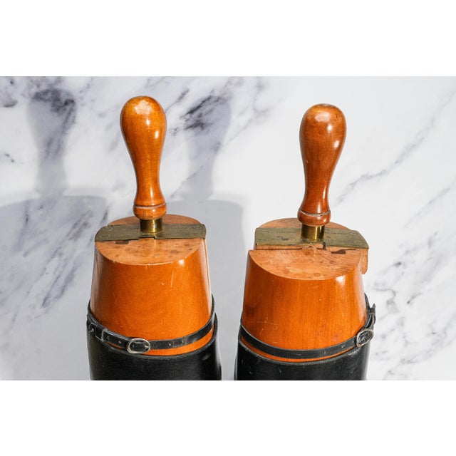 Capture the spirit of classic English country life with this striking pair of antique circa 1920s black leather riding...