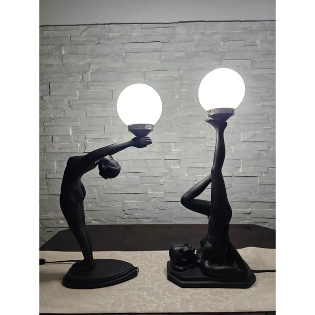 Art Deco Style Nude Metal Female Table Lamps. Figural Table Lamp With White Glass Ball Shade. Most probably made of black...