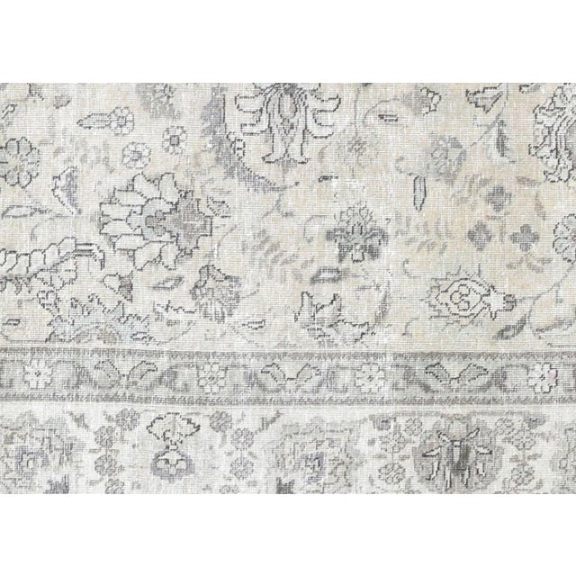 1960s Persian Tabriz Rug. Hand woven in the Tabriz region of Northern Iran. Distressed and refinished in the U.S. The...