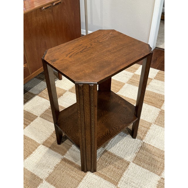 A beautiful original art deco side table, circa 1940s. Has an elegant architectural form with the angled supports creating...