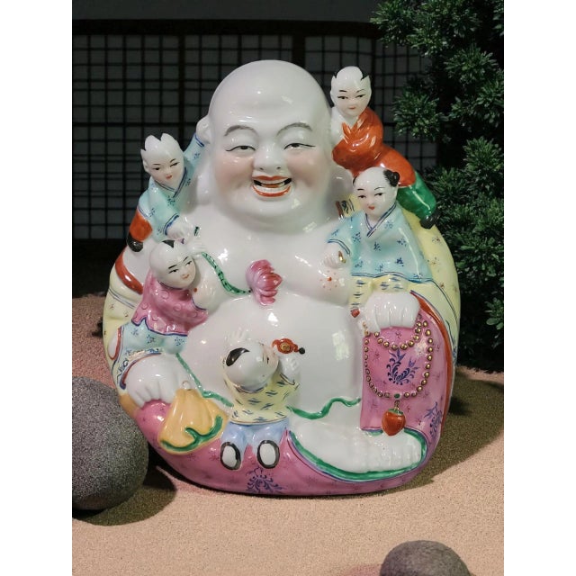 This Vintage Hand Painted Colorful Famille Rose Fertility Happy Buddha Statue originates from China, showcasing the...