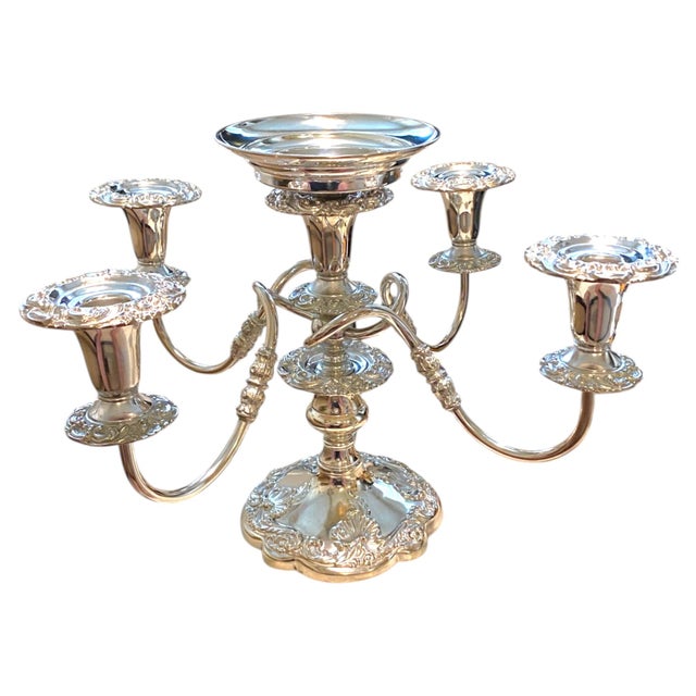 Elegant vintage silver-plated candelabra by the Sheffield Silver Company, made in the USA. Features four candle holders...