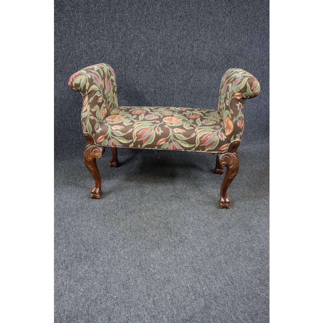 Chippendale Style Upholstered Window Bench, scrolled arms, floral upholstery, mahogany legs with acanthus decoration at...