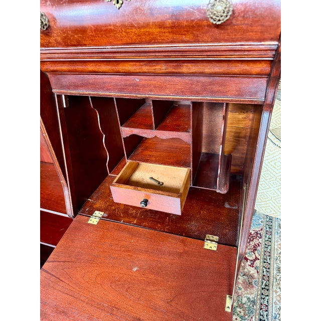 Secretary/bookcase in remarkably intact condition. Key included. 76 3/4” tall, 41 1/2” wide, 15” deep.