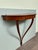 A half-moon wall console, a refined piece of Italian design from the 1950s inspired by the style of architect and designer...