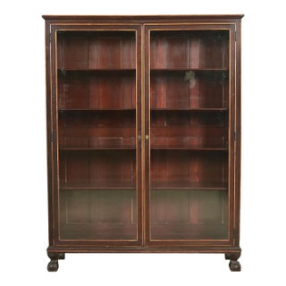 R. J. Horner Style American Empire Carved Mahogany Bookcase With Ball and Claw Feet, Circa 1890s For Sale