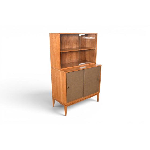 This credenza with hutch is from Paul McCobb's Planner Group line, produced by Winchendon Furniture Company in the USA...