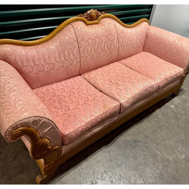 This is a vintage, French Provincial-style 3 seater sofa characterized by its ornate carved wooden frame, sweeping curves,...