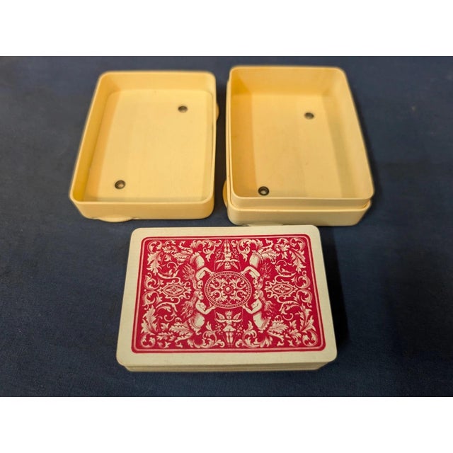 This vintage early twenteeth century playing card holder is beautifully designed in a cream colored celluloid accented...