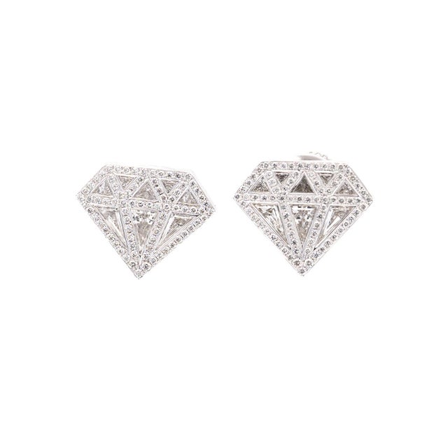 Diamond Shaped Diamond Stud in 18K White Gold Earrings. Crafted in 18k white gold, with push-back closure. These diamond...