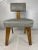 Single mid century modern boxy armless chair with exposed angled oak wood legs and vinyl upholstered back and seat....