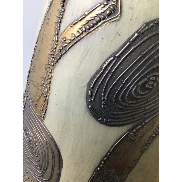 1950s large pair of ceramic lamps on wood bases. Scene of villagers. Ceramic, hand painted using a gilt finish and raised...