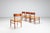 Set of four Danish dining chairs in teak and paper cord, Denmark, 1960s. An elegant set of mid-century dining chairs...