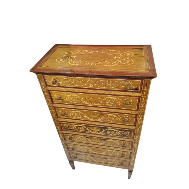 Chest of drawers with seven drawers in style.