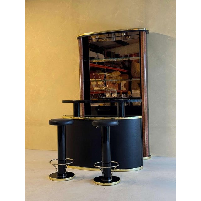 Amazing Hollywood style cocktailbar in exclusive Black lacquered and burlwood material. Big illuminated back bar element...