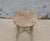 A charming vintage Chinese stool crafted from solid elmwood, dating to the first half of the 20th century. The round seat...