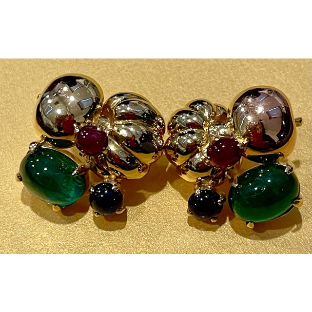 12 Carat Cabochon Emerald Diamond Clip Earrings 14 Karat Yellow Gold, Estate This exquisite pair of earrings are...
