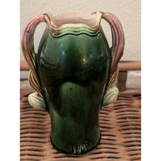 A charming small-scale 5" majolica vase in the French Art Nouveau naturalistic style, with a hand-modeled iris in high...