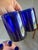 Striking set of seven cobalt blue lowball glasses in a sophisticated Art Deco-inspired form. Hand-blown and beautifully...