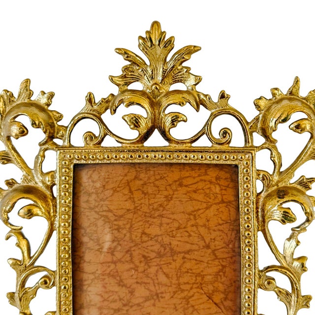 Elevate your gallery wall with this vintage Italian Rococo-style photo frame crafted from solid cast brass. Featuring a...