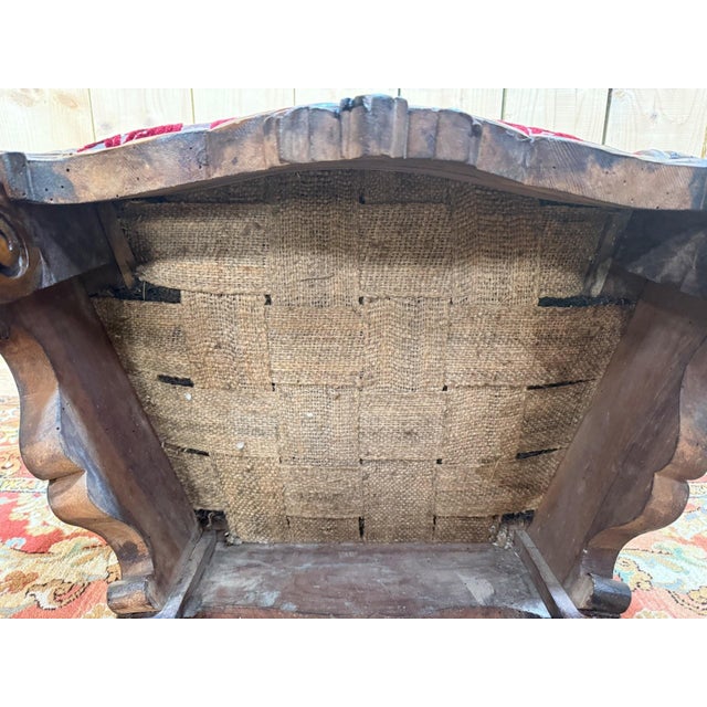 A Renaissance/Louis XIII style ceremonial armchair, dating from the early 19th century, entirely carved in solid dark-...