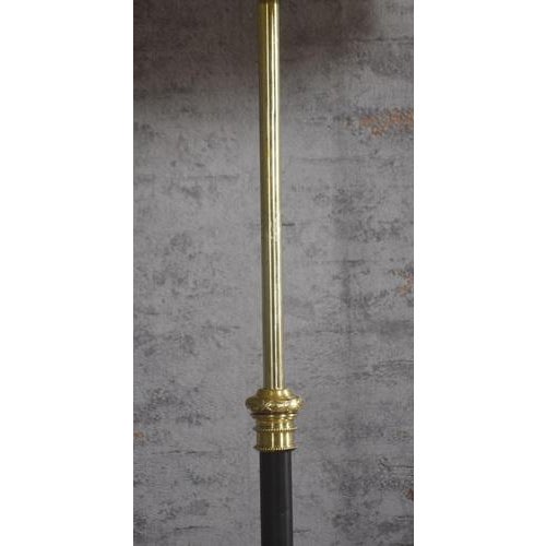 Art Nouveau brass standard lamp, the adjustable brass column raised on a circular base with strap work supports...