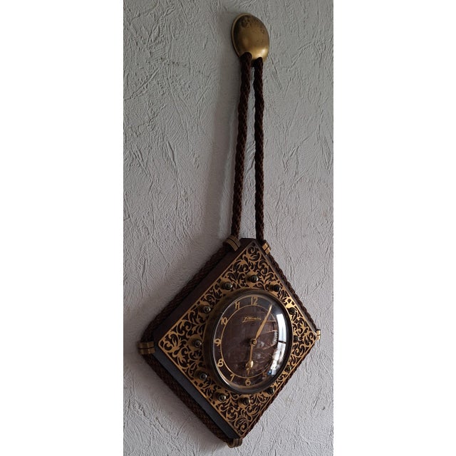 Mid-Century Mechanical Wall Clock with Brass-Decorated Front from Atlanta, 1950s, in Very Good conditions. Designed 1950...