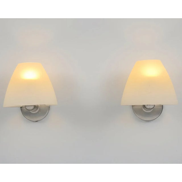 An authentic pair from the golden era of Italian modernism, these Sally wall sconces were produced in Italy by Flos in the...