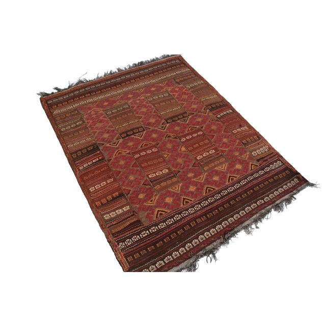 From Josh Nazmiyal’s personal collection of coveted vintage pieces, a 4x5 handwoven vintage Afghan kilim rug with a mild...