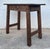 This side or coffee table exhibits characteristics of a rustic style of European origin, with influences that could point...