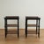 Standout pair of vintage British colonial style stands with an ebonized finish, having three caned tiers on turned faux...