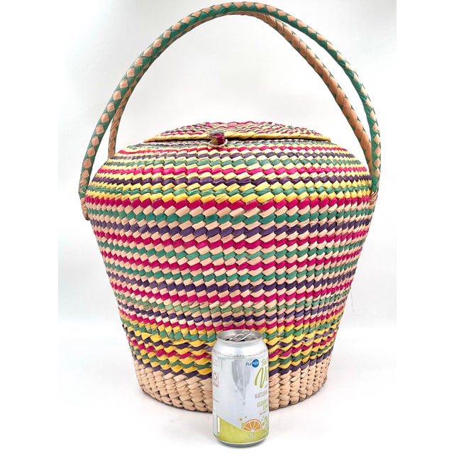 This vintage XL rainbow colored woven seagrass snake charmer-style basket is big enough to hold toys, a blanket,...