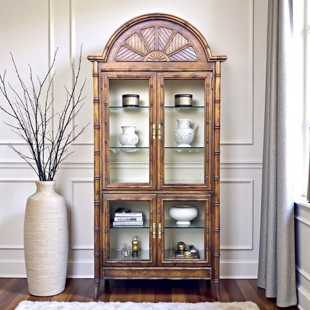 This exceptional vintage faux bamboo display cabinet is a true statement piece, distinguished by its rare arched crown...