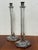 Design Plus Gallery presents a Pair of Vintage Glass Candlesticks from unknown brand. The candlestick frames are elongated...